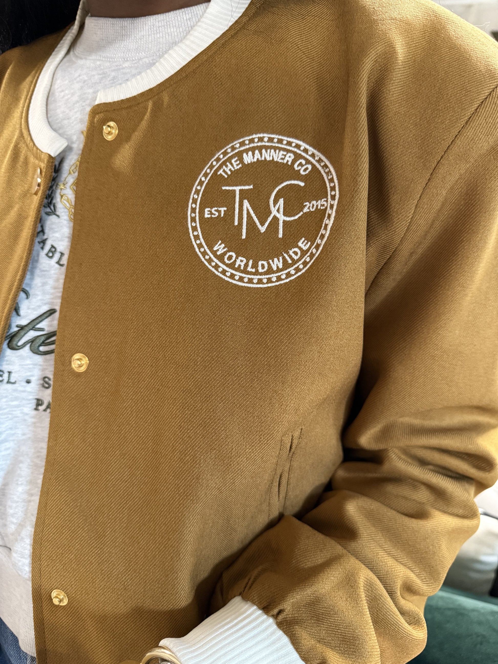 The Manner Bomber front with embroidered tmc logo